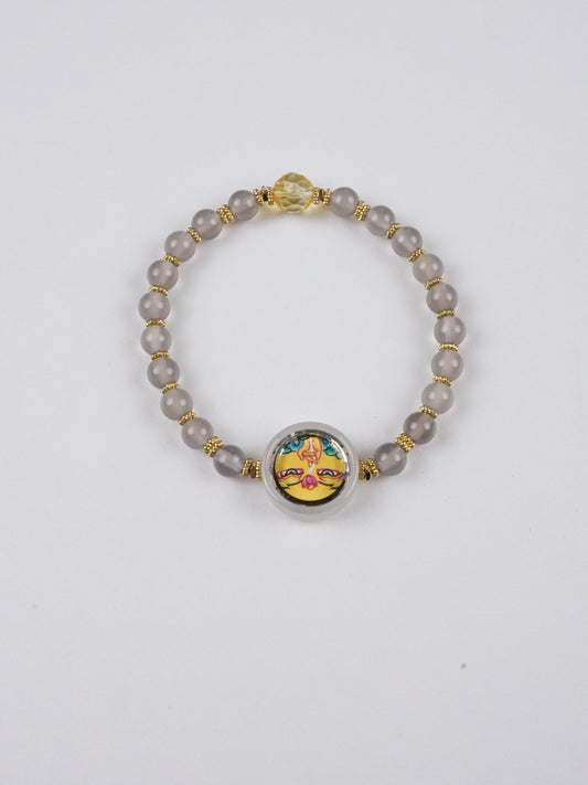 Authentic Tibetan-Buddhist Dzambhala mini Thangka bracelet painted with mineral pigments, a sacred Buddha art piece invoking blessings of wealth and protection