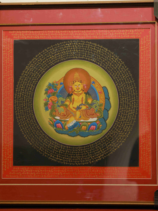 Hand-painted Tibetan Thangka of Yellow Jambhala, the Buddhist deity of wealth and abundance, on canvas.