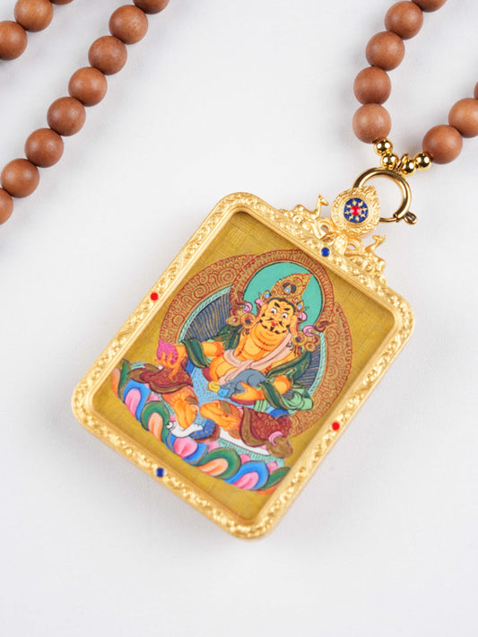 Rectangular Tibetan wealth deity pendant with gold and mineral pigments