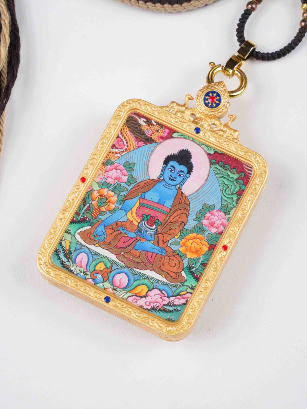 Tibetan Buddhist Medicine Buddha thangka painting, meticulously hand-painted with vibrant natural mineral pigments on traditional canvas.