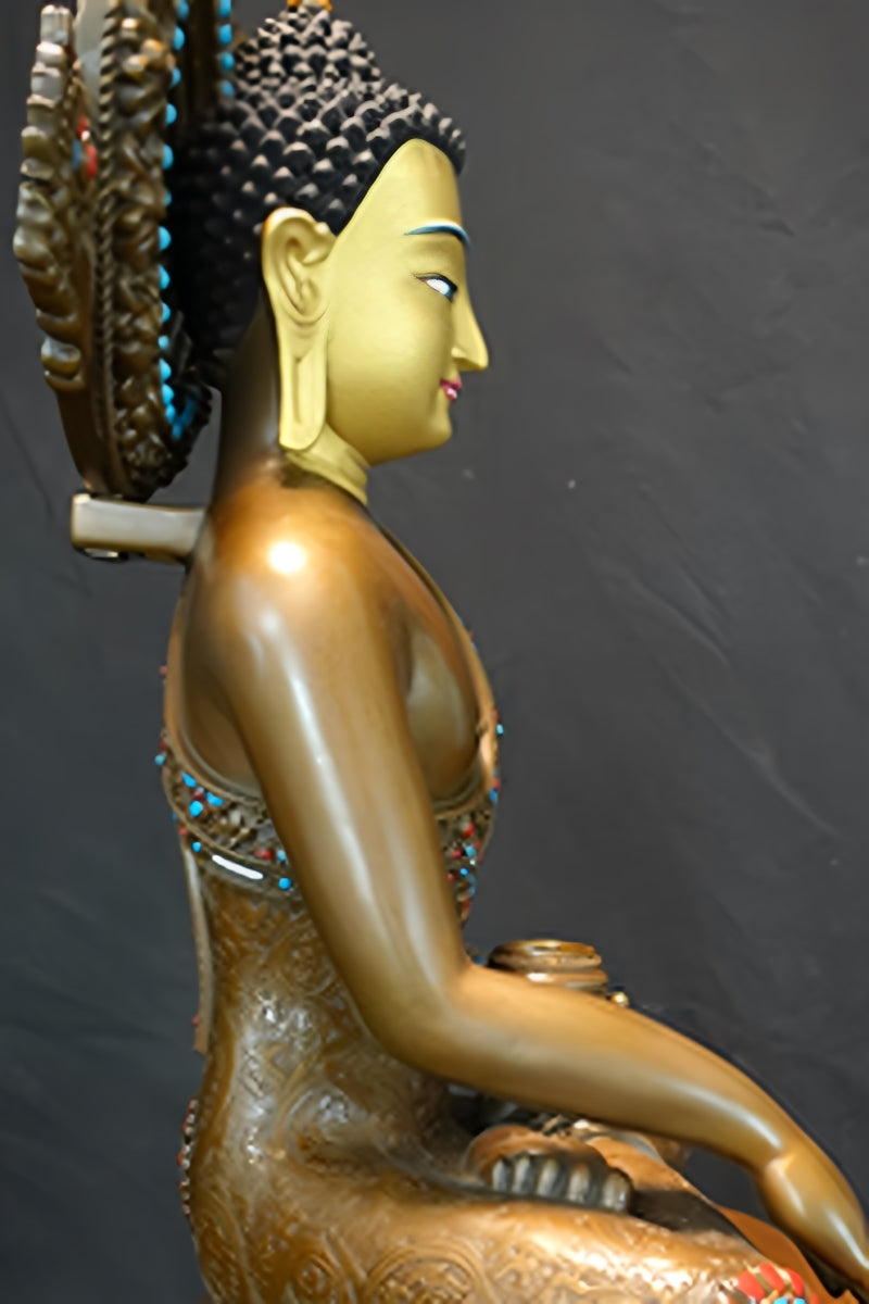 Shakyamuni Buddha statue-art in brass, with hand-painted Tibetan Buddhist motifs and vibrant designs.