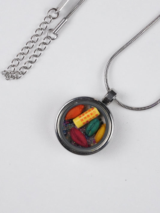 Hand-painted tibetan-buddhist colorful candy pendant crafted on thangka canvas with mineral pigments, a unique tibetan Buddha art jewelry piece symbolizing joy and harmony.