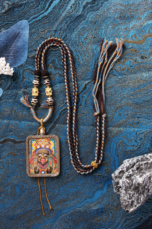 Detailed view of the multi-layered gold powder (Tu Jin) technique used on the Zaki Lhamo Thangka core by master Rebgong Lama artists.