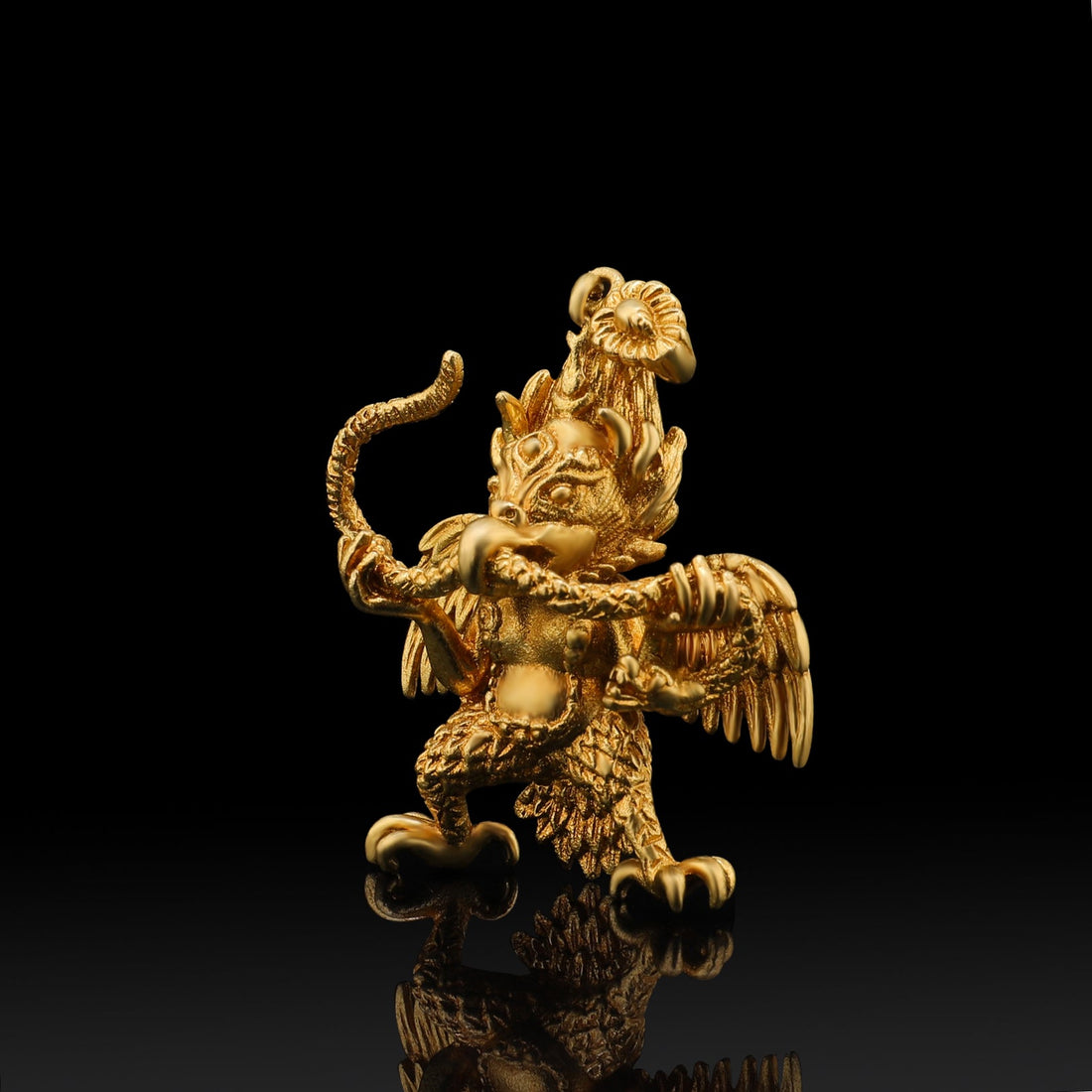 Tibetan-Buddhist Garuda pendant in brass, hand-painted, symbolizing strength and wisdom. Unique jewelry art.