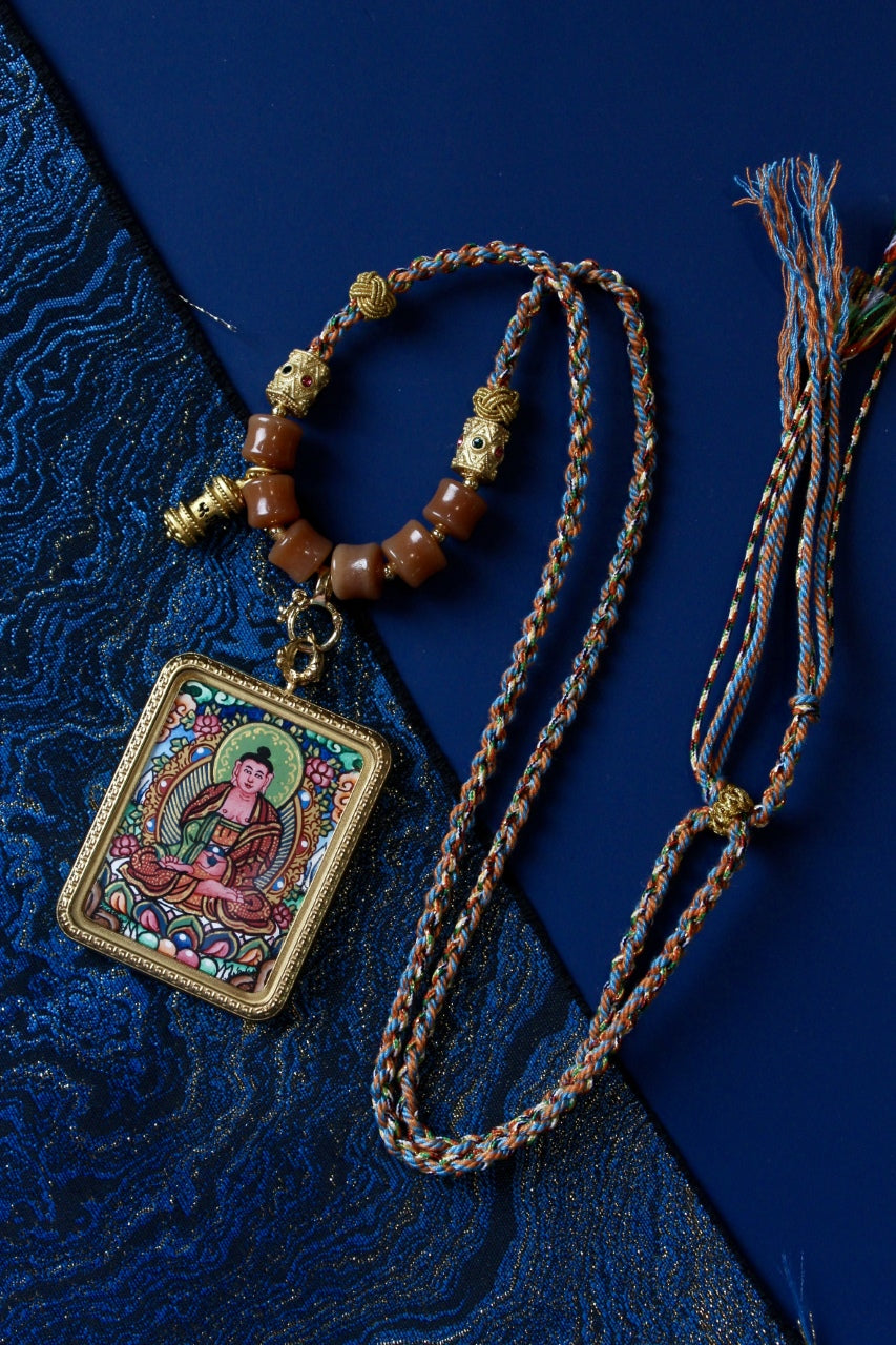 Amitabha Buddha Thangka Amulet, a powerful symbol of compassion and wisdom in Tibetan Buddhist tradition.