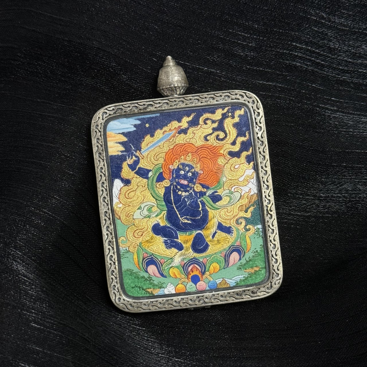  Close-up detail of the Tibet Bold Acala Thangka painting showing intricate natural mineral pigment work and wrathful symbolism, showcasing the masterful artistry of Tibetan lineage painters.

