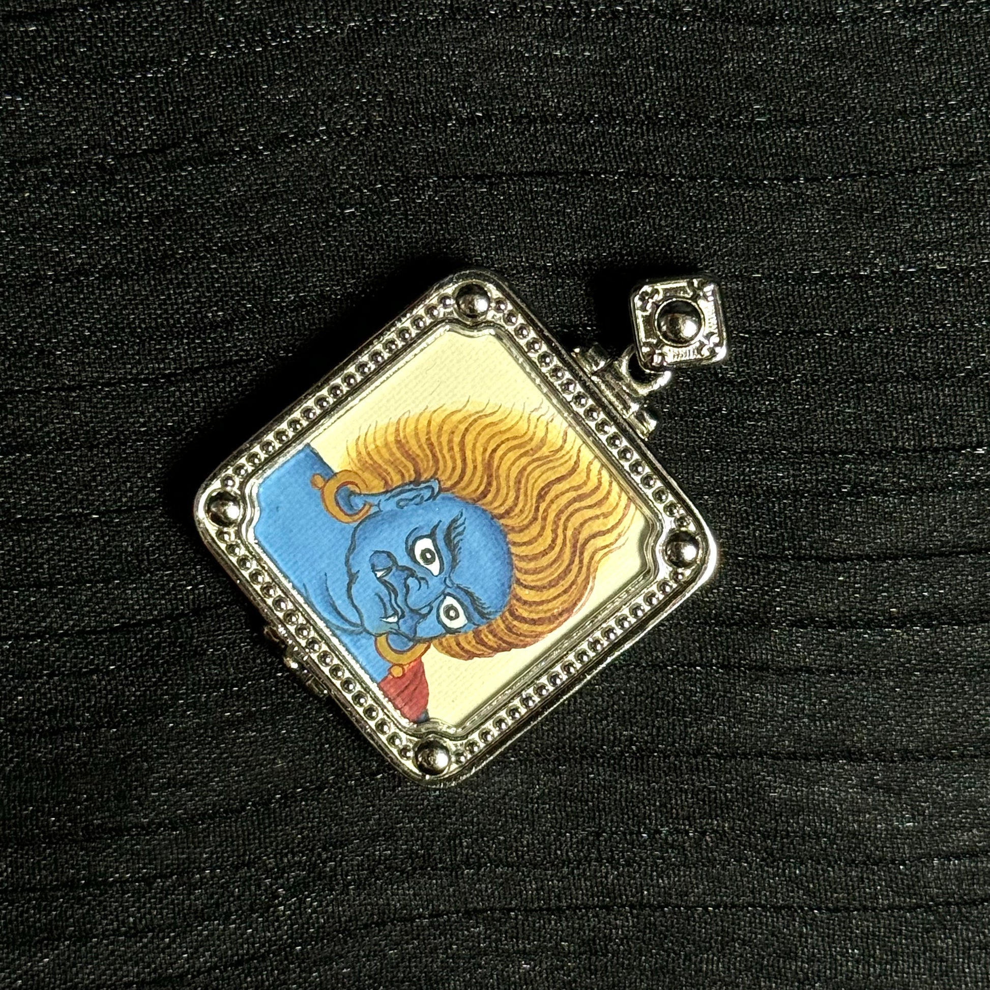  A 4x5cm hand-painted Tibet Bold Six-Armed Mahakala (Great Black One) Thangka pendant featuring the great protector and god of enterprise, encased in 925 silver, dual-face capable, representing pacification and increase in Tibetan Buddhist tradition.

