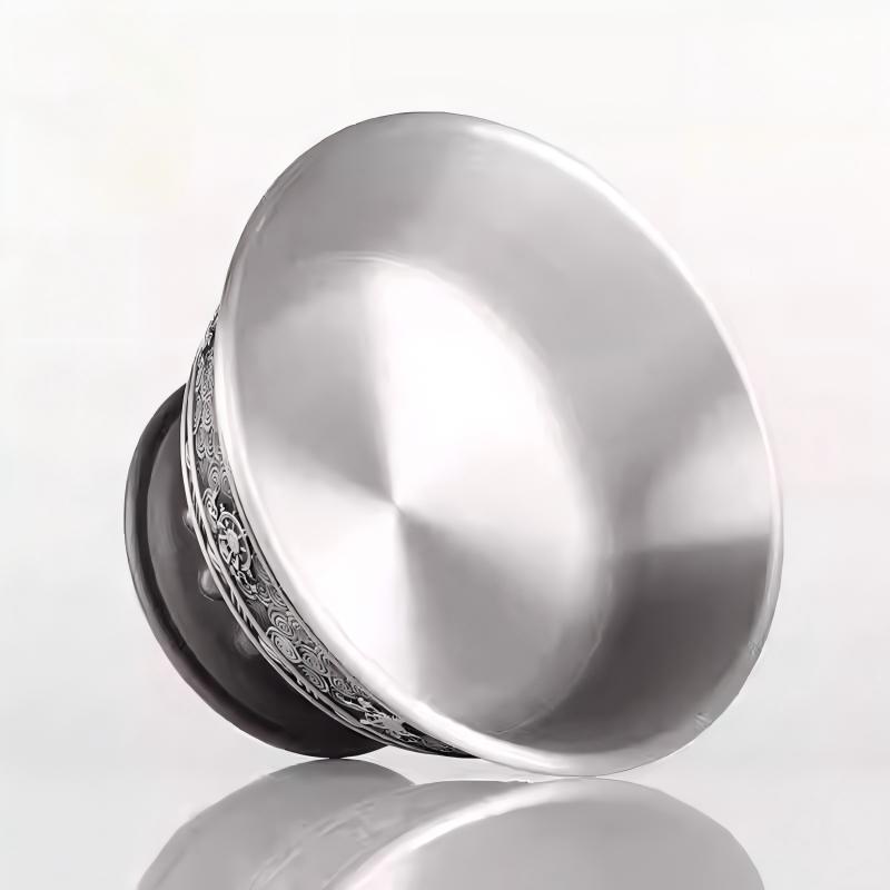 Tibetan Buddhist sacrificial implements culture: A dignified pewter Dharmapala cup engraved with Eight Auspicious Symbols, featuring a high-foot design for sacred offerings.