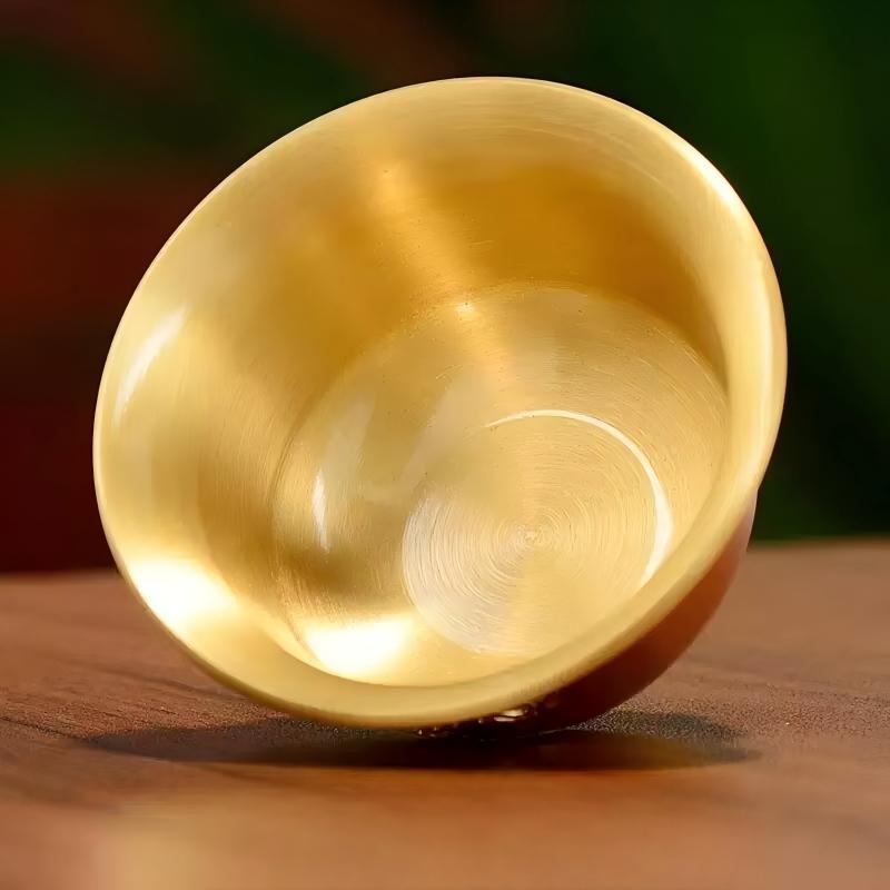 Tibetan Buddhist sacrificial implements culture: Close-up of hand-engraved lotus water cups showcasing exquisite Buddhist sacrificial items art and delicate petal details.
