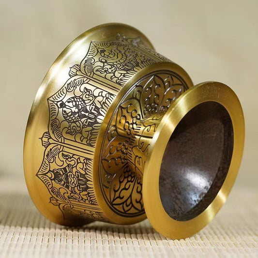 Tibetan Buddhist sacrificial implements culture: Close-up of hand-engraved water cups showcasing exquisite Buddhist sacrificial items art and traditional Himalayan craftsmanship.