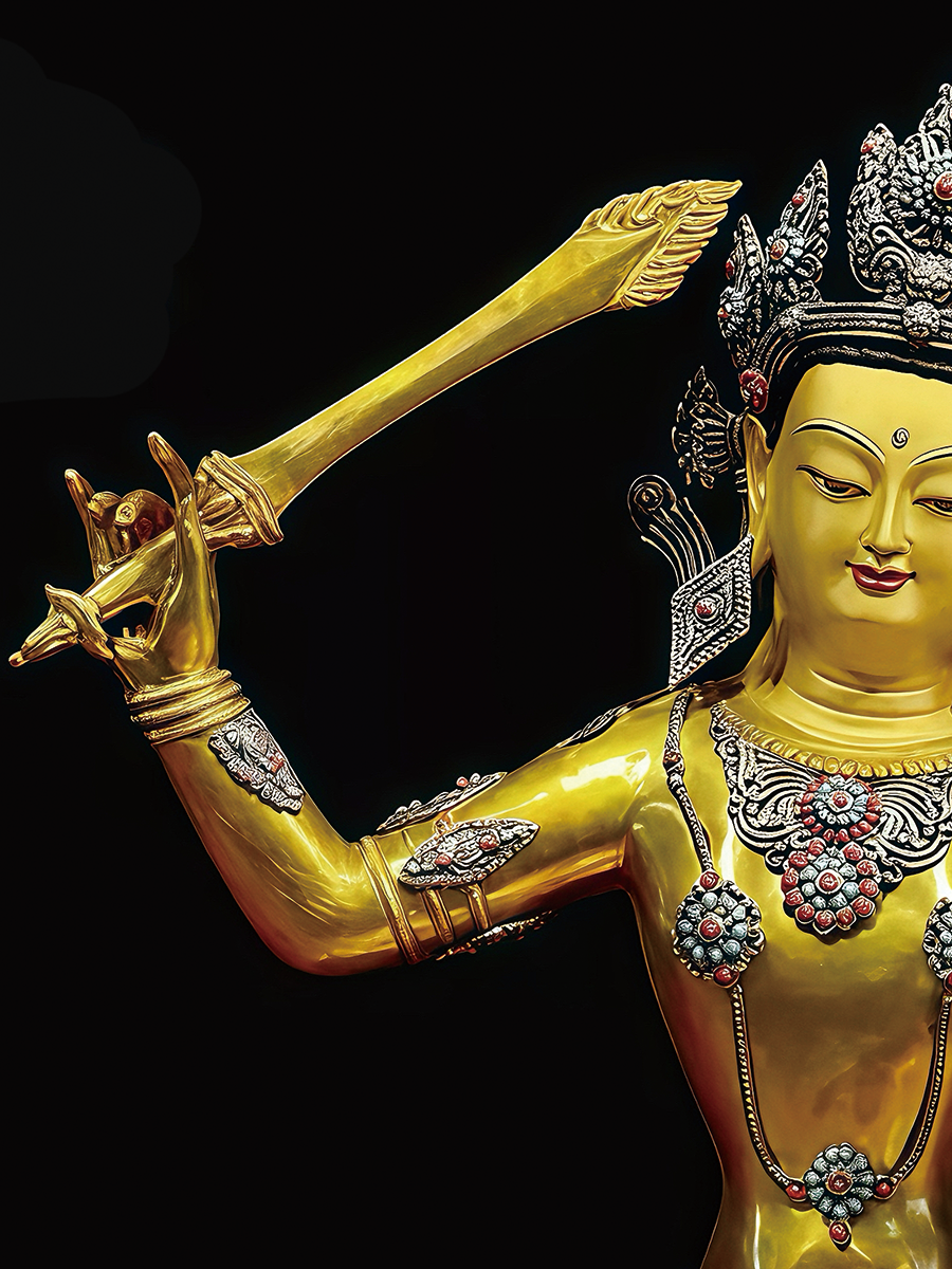 Detailed hand-painted gold finish on a pure copper Manjushri, representing premium Buddha Statue-Art in 2026.
