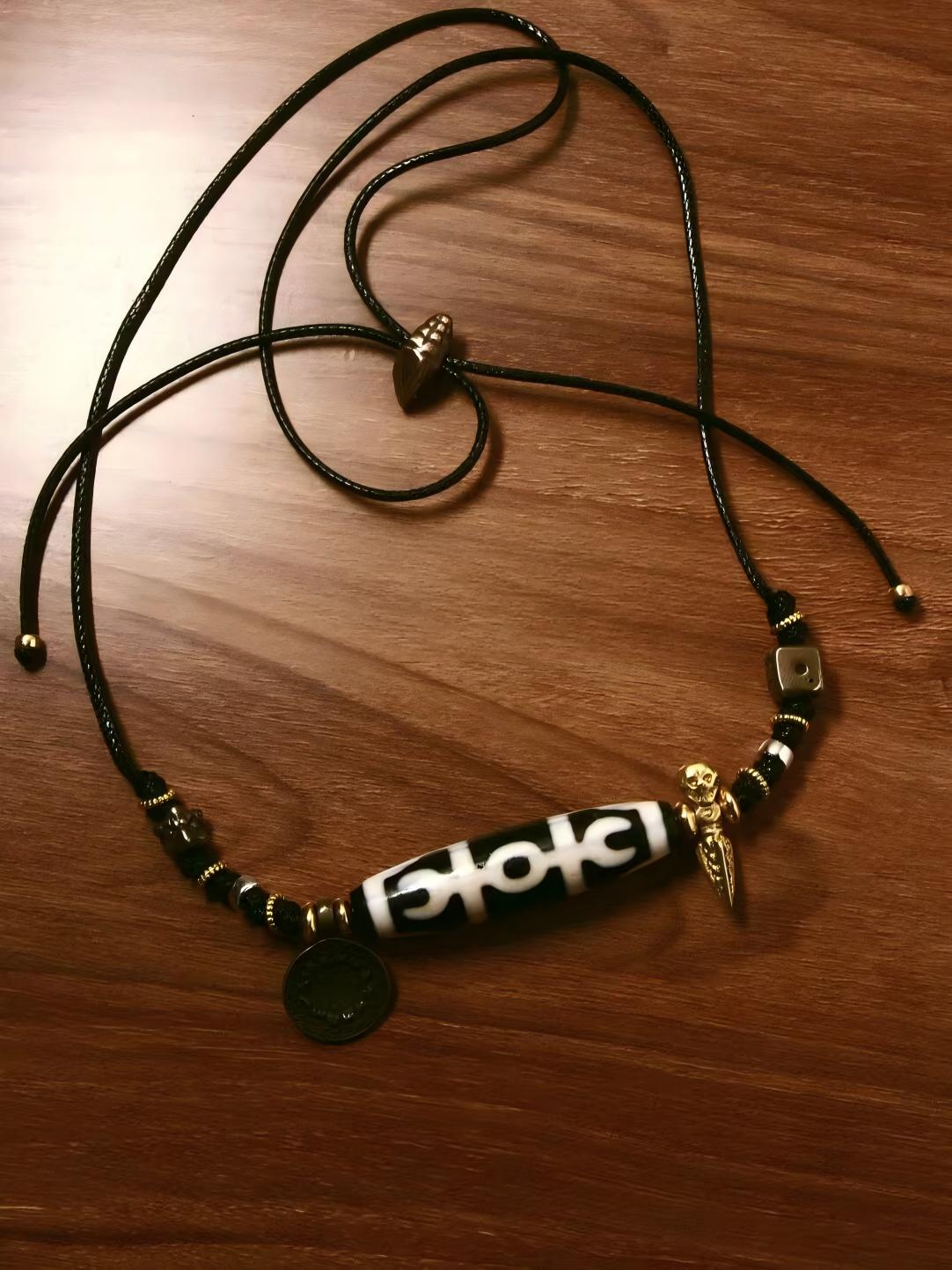 Handcrafted Agate Tianzhu and TianTie with a collarbone chain, representing spiritual protection and enlightenment in Tibetan Buddhist Jewelry Art.