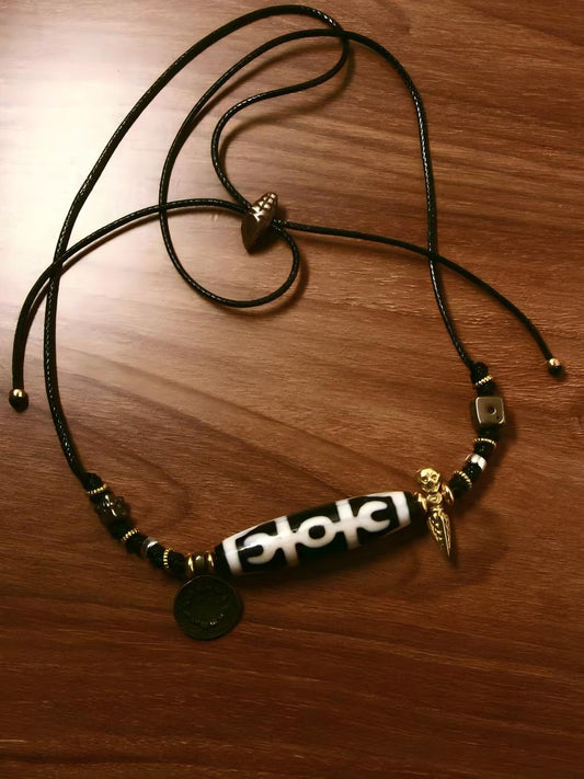 Handcrafted Agate Tianzhu and TianTie with a collarbone chain, representing spiritual protection and enlightenment in Tibetan Buddhist Jewelry Art.