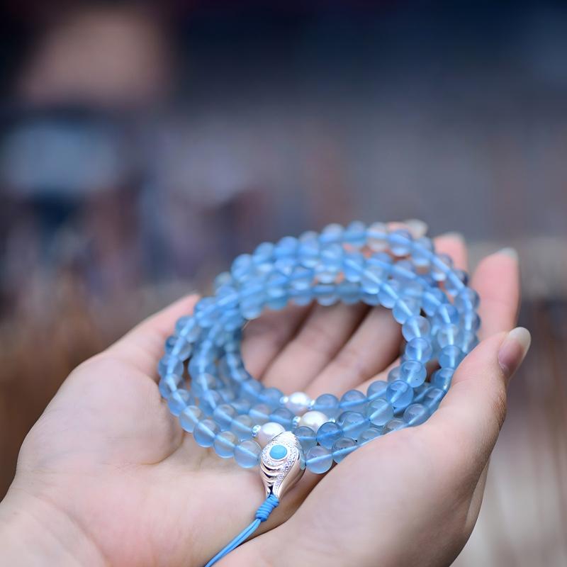 Tibetan Buddhist Jewelry Culture: Exquisite aquamarine prayer beads rosary bracelet, a masterpiece of Tibetan Buddhist implements culture.