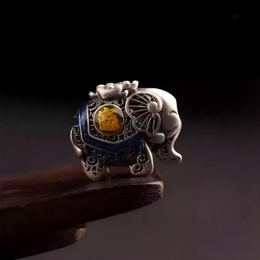 Handmade silver hollow elephant spacer bead on mala, representing wealth in Tibetan Buddhist Jewelry Culture and jewelry art.