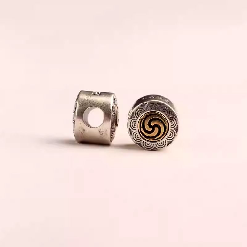 Versatile Tibetan mala back cloud bead with a large bore design, functional jewelry art for spiritual prayer beads.
