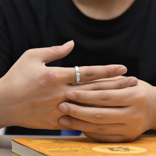 Hand-polished oxidized silver mantra ring with Heart Sutra script, showcasing traditional Tibetan-Buddhist Jewelry Culture.
