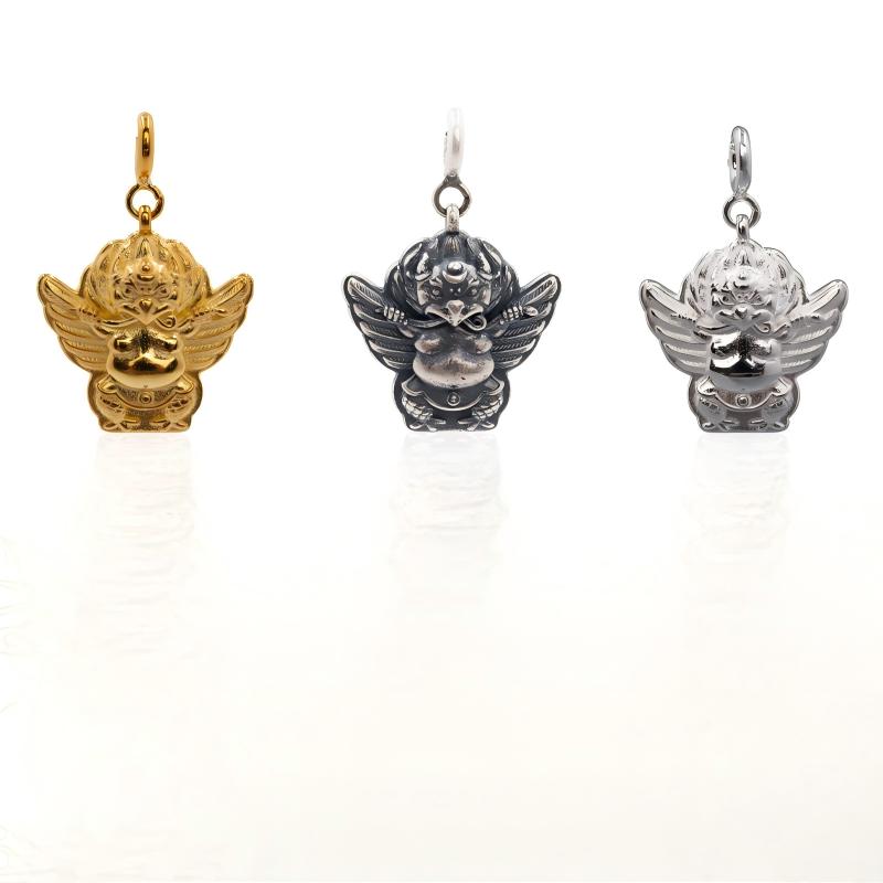 Hand-painted silver Dapeng Jinchi Bird amulet, showcasing traditional Tibetan Buddhist Jewelry Culture and exquisite Jewelry art.
