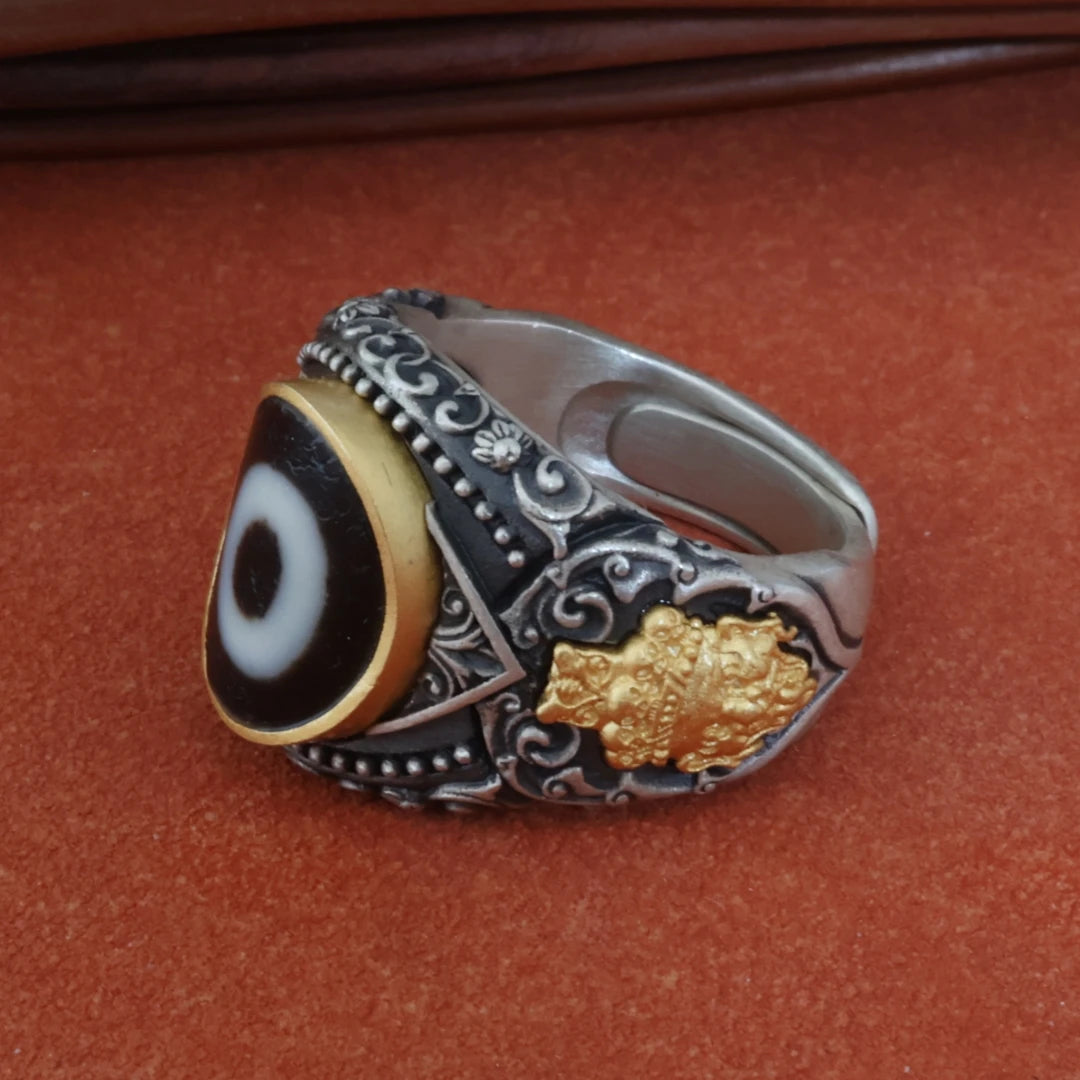 Artisan silver Zhakiram one-eye ring reflecting Tibetan Buddhist Jewelry Culture, carefully handcrafted as a spiritual jewelry art accessory.