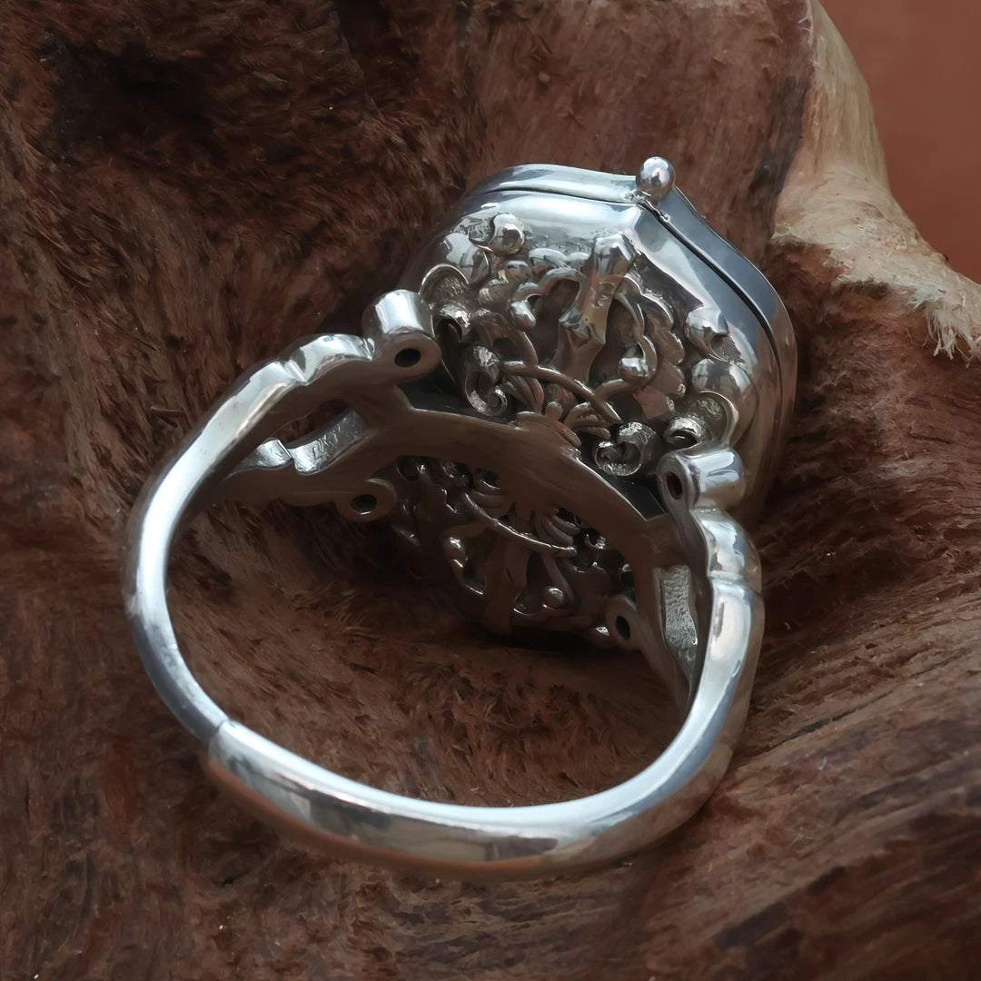  Intricate hand-carved Healing Buddha ring, showcasing artisan jewelry art inspired by Tibetan Buddhist Jewelry Culture.