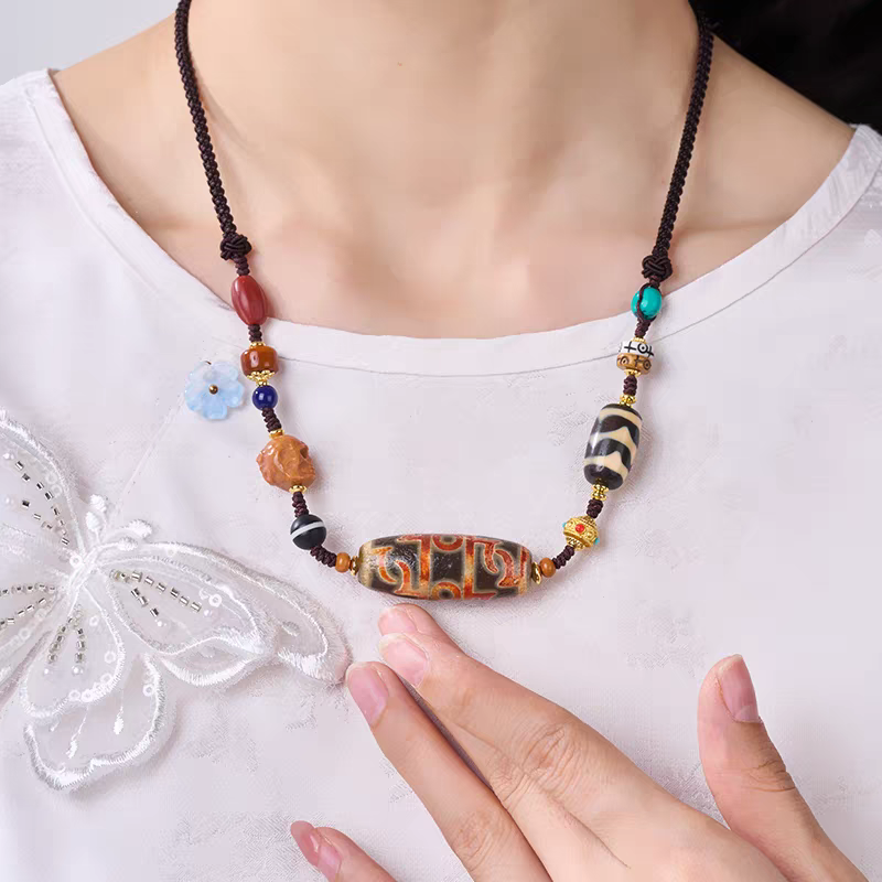 Authentic handmade barley grain texture Lotus Guru Dzi bead bracelet, showcasing jewelry art and Tibetan Buddhist Jewelry Culture.