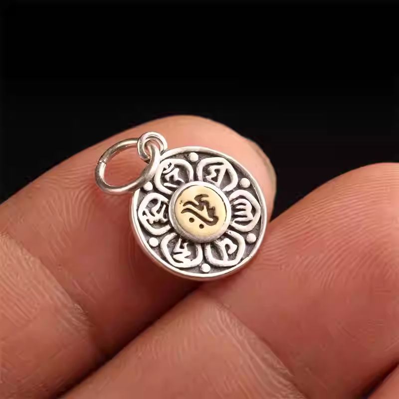 Tibetan Buddhist Jewelry Culture silver lotus and six-syllable mantra side charm. A sacred piece of jewelry art for mala customization.