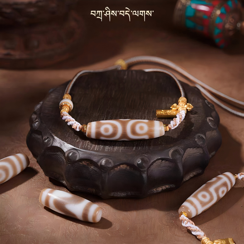 Tibetan Buddhist Jewelry Culture necklace featuring nine-eyed, six-eyed, and three-eyed Dzi beads. A powerful piece of jewelry art for success.
