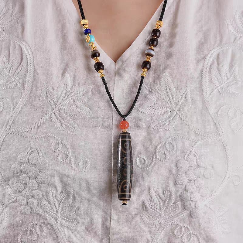 Authentic 21-eyed Dzi bead, showcasing beautiful jewelry art and Tibetan Buddhist Jewelry Culture. Purely handmade.