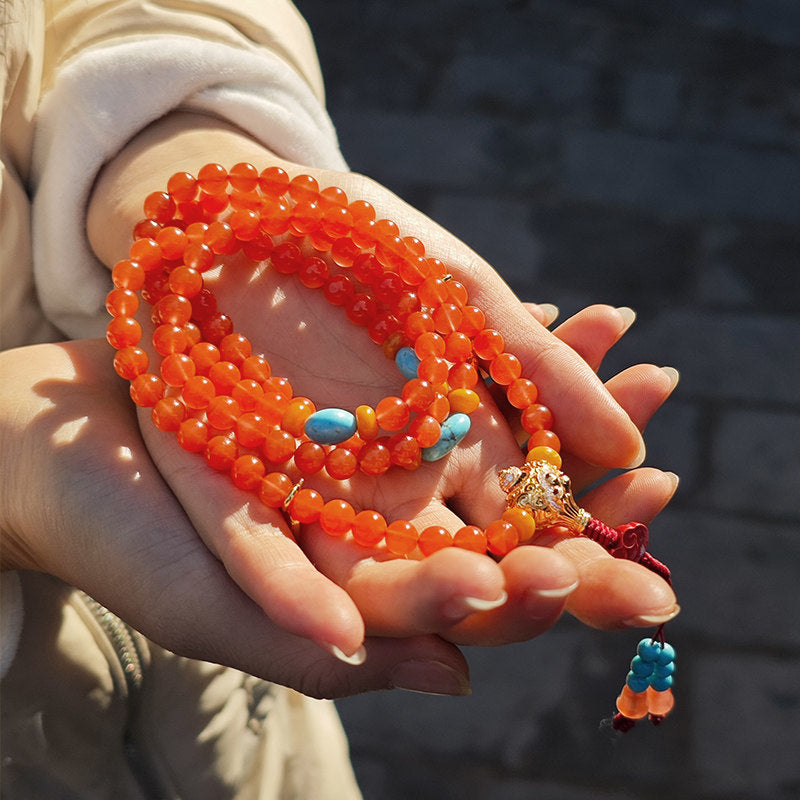 Tibetan Buddhist Jewelry Culture: Exquisite red agate prayer beads rosary bracelet, a masterpiece of Tibetan Buddhist sacrificial implements culture.