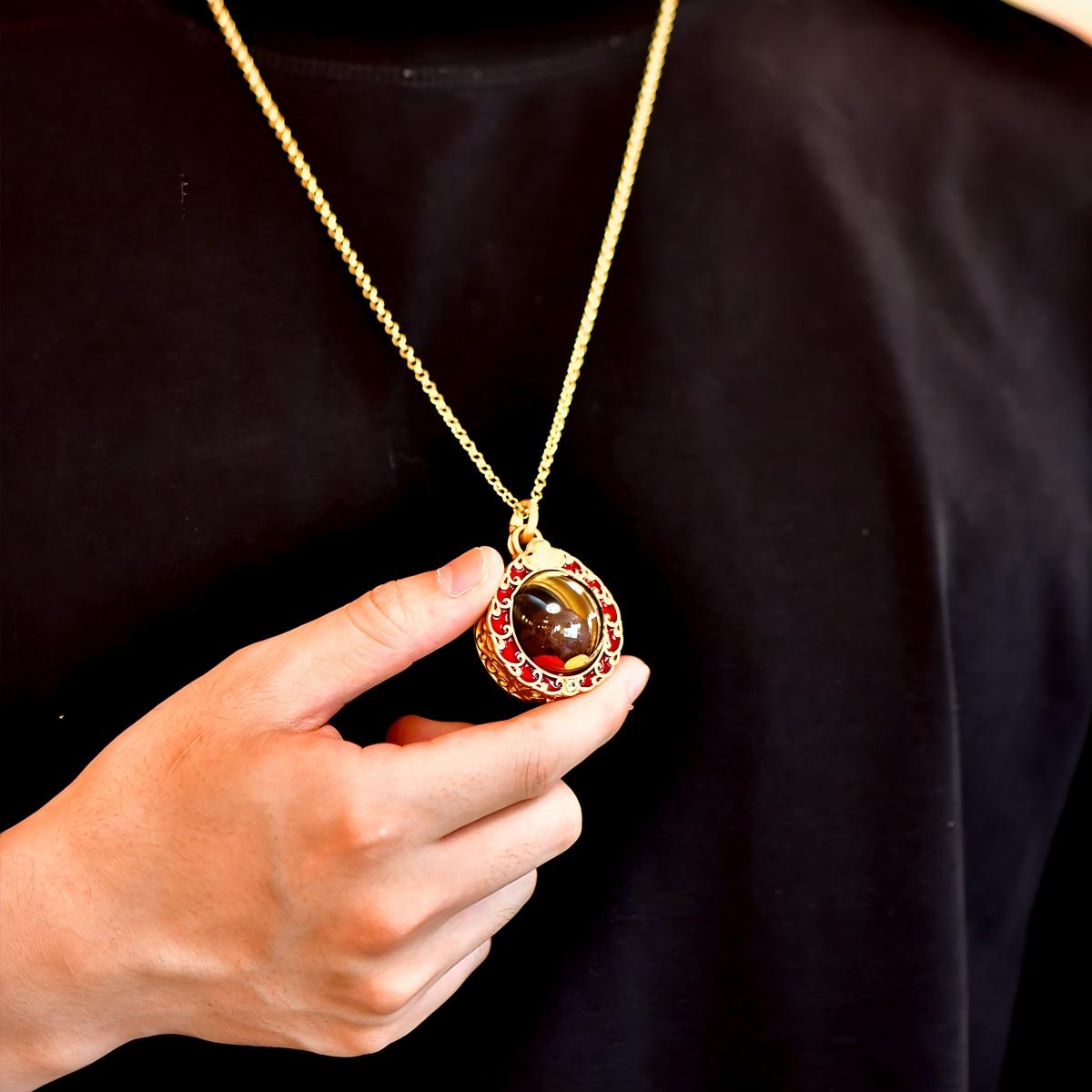 Tibetan Buddhist Jewelry Culture: A handmade brass jewel Gau box amulet, showcasing sacred Buddhist jewelry art and wish-fulfilling symbols.