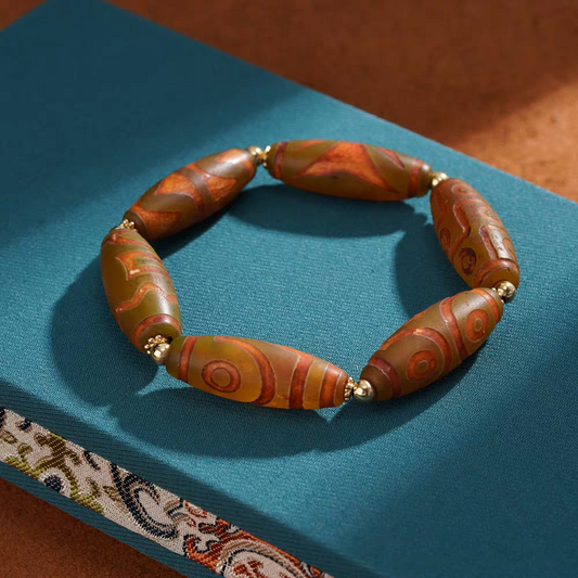 Handcrafted Tibetan Buddhist barley fire multi-treasure bracelet, a unique jewelry art piece for spiritual protection and positive energy.