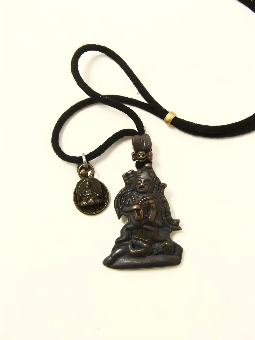 Handcrafted Iron Black Jambhala Statue with Four-Armed Guanyin and Manzushri Bodhisattva, representing spiritual protection, wisdom, and transformation in Tibetan Buddhism.