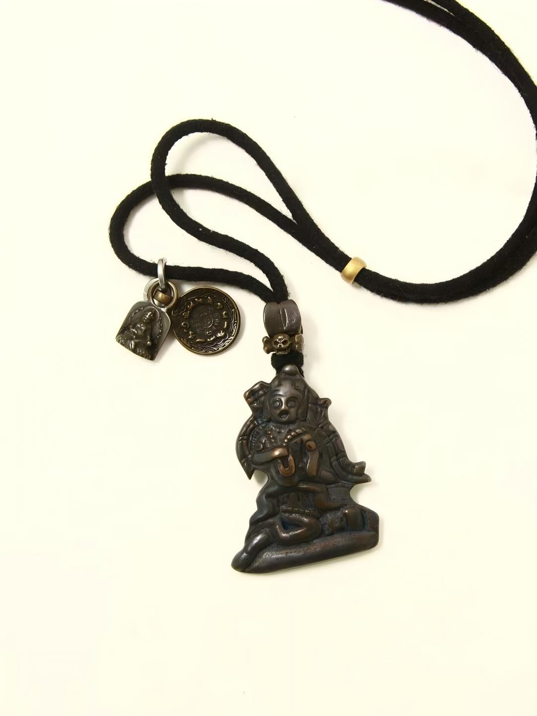 Handcrafted Black Jambhala Iron Vajra Hand Statue with Four-Armed Guanyin Bodhisattva, representing spiritual protection and power in Tibetan Buddhist Jewelry Culture.