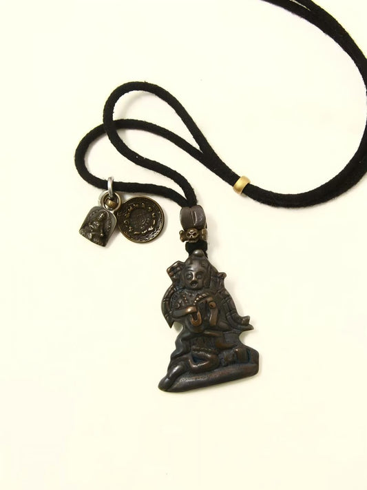 Handcrafted Black Jambhala Iron Vajra Hand Statue with Four-Armed Guanyin Bodhisattva, representing spiritual protection and power in Tibetan Buddhist Jewelry Culture.