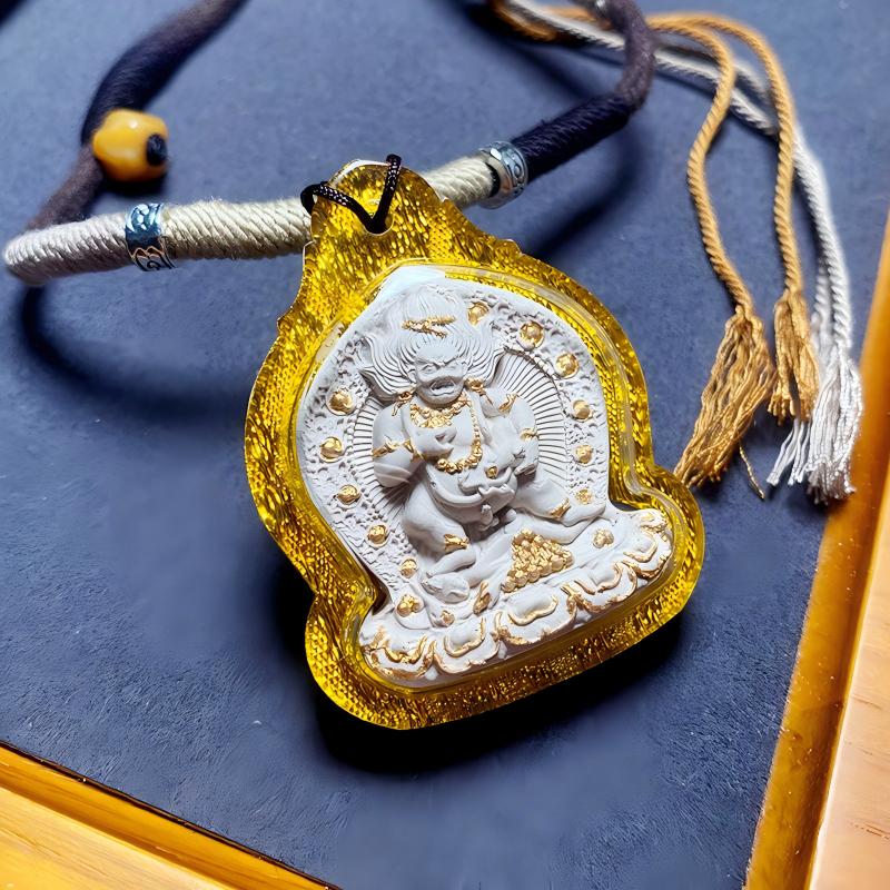 Black Dzambhala Thangka amulet pendant rooted in Tibetan Buddhist Jewelry Culture, handcrafted Jewelry art necklace for blessings and spiritual wealth