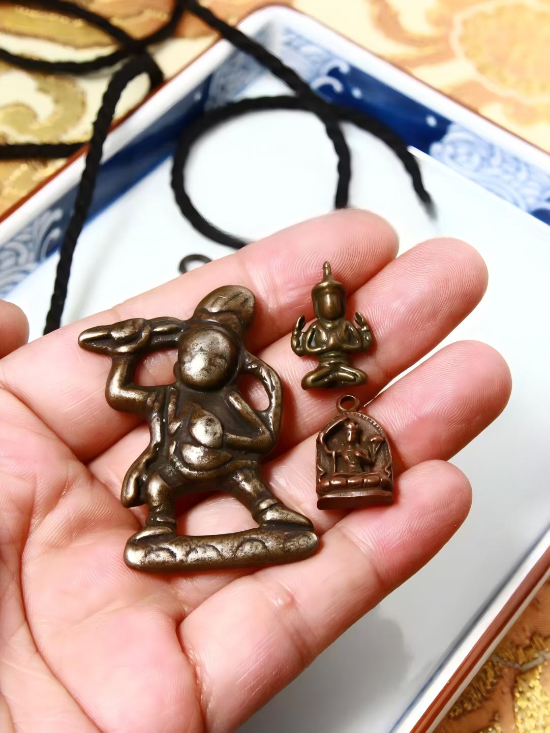 Black Jambhala and Yellow Jambhala Iron Figurine, intricately crafted in Tibetan Buddhist Jewelry Art, embodying divine wealth, protection, and spiritual growth.