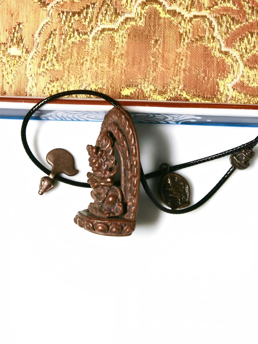 Tibetan Buddhist Jewelry Culture-inspired bronze Mahakala figure with Baogang Huozhu design, showcasing traditional hand-painted art and powerful spiritual symbolism