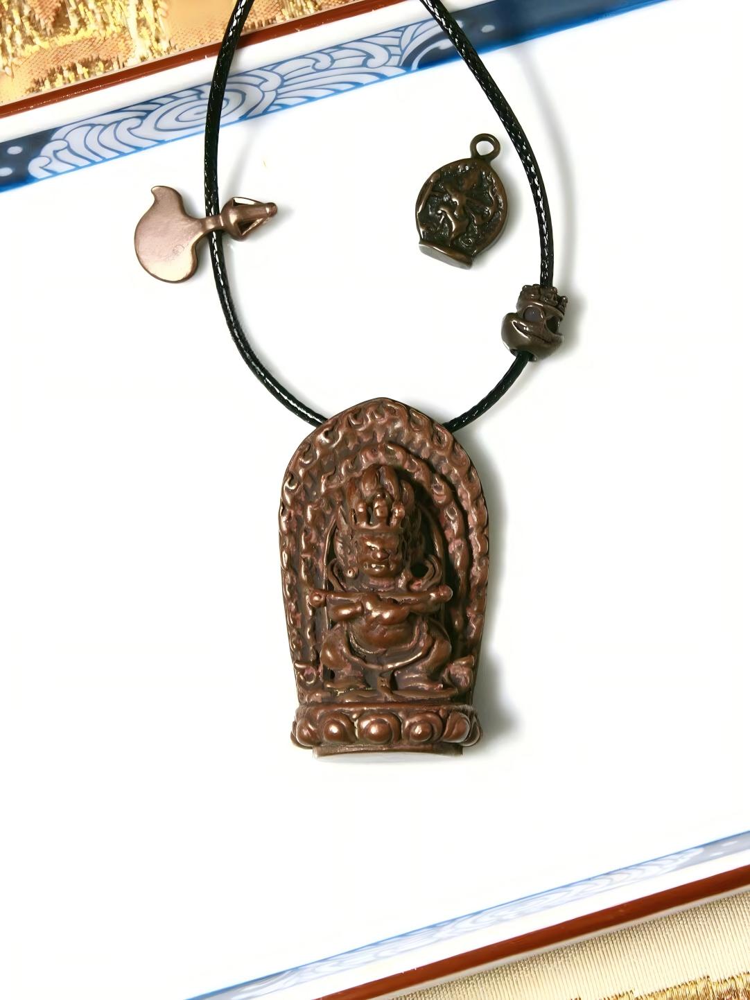 Handcrafted bronze Mahakala figure with Baogang Huozhu motifs, reflecting Tibetan Buddhist Jewelry Culture, with intricate hand-painted details symbolizing wisdom and protection