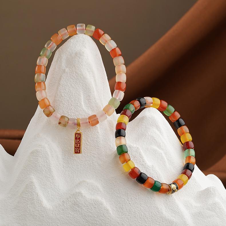 Handmade Dark Agate Jambhala Money Magnet Bracelet, embodying the sacred art of Tibetan Buddhist Jewelry Culture for financial blessings.