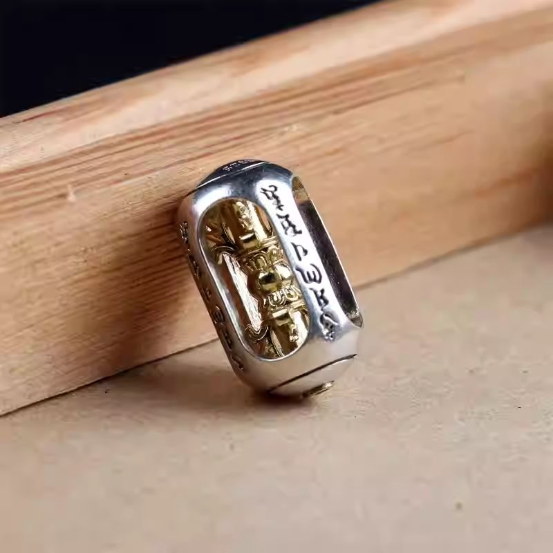 Handmade rotatable silver Vajra Dorje mala beads, a sacred centerpiece of Tibetan Buddhist Jewelry Culture and jewelry art.