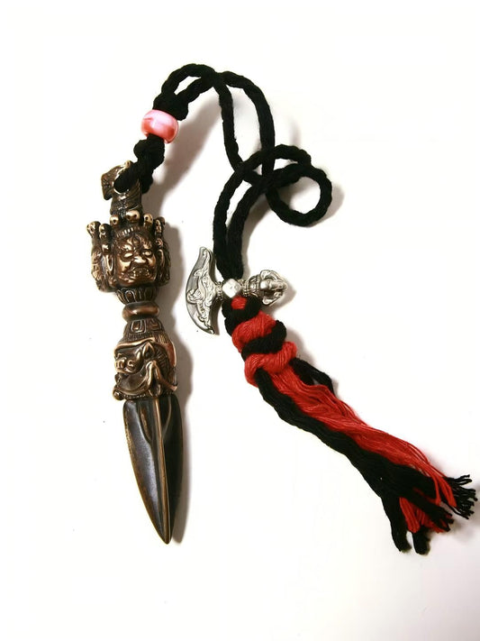 Handcrafted Mahakala Pubha Vajra with intricate design, symbolizing protection and spiritual strength in Tibetan Buddhist Jewelry Art.