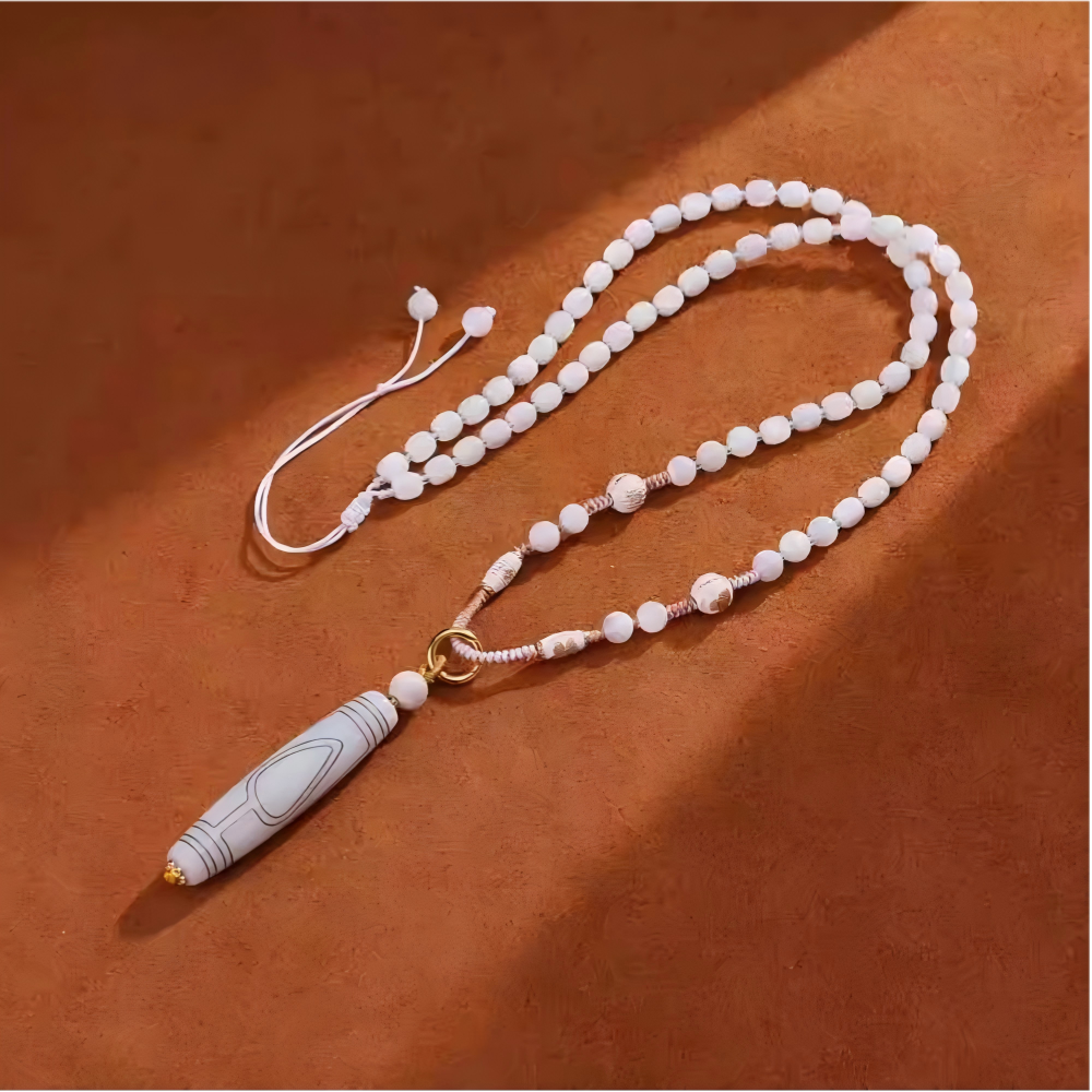 Authentic gold-inlaid Tang Tube Dzi bead paired with Bodhi, showcasing jewelry art and Tibetan Buddhist Jewelry Culture. Purely handmade.