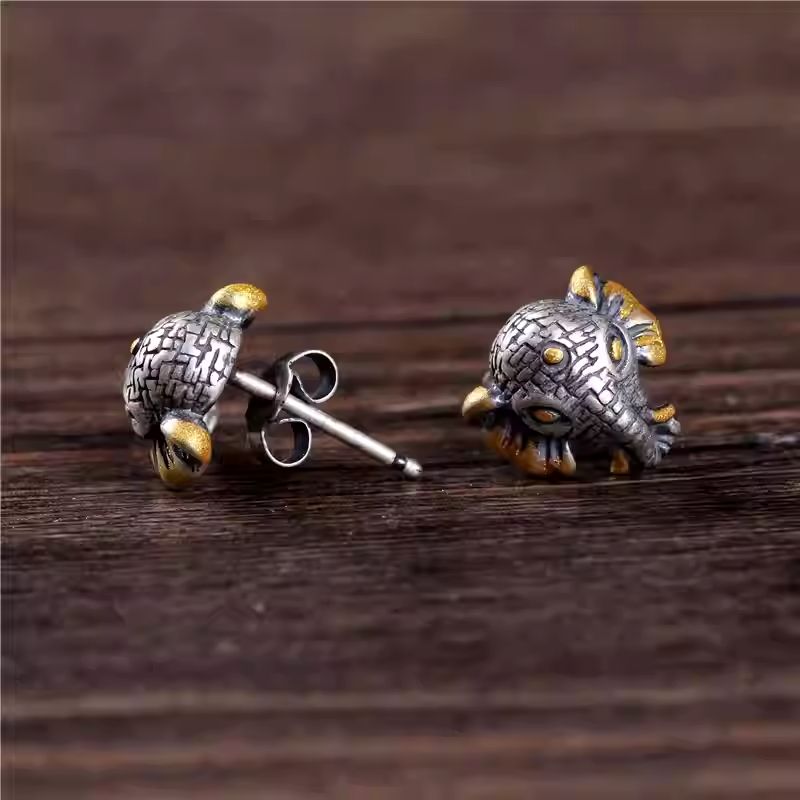 Hand-painted vintage elephant studs in sterling silver, showcasing Tibetan Buddhist Jewelry Culture and exquisite Jewelry art.
