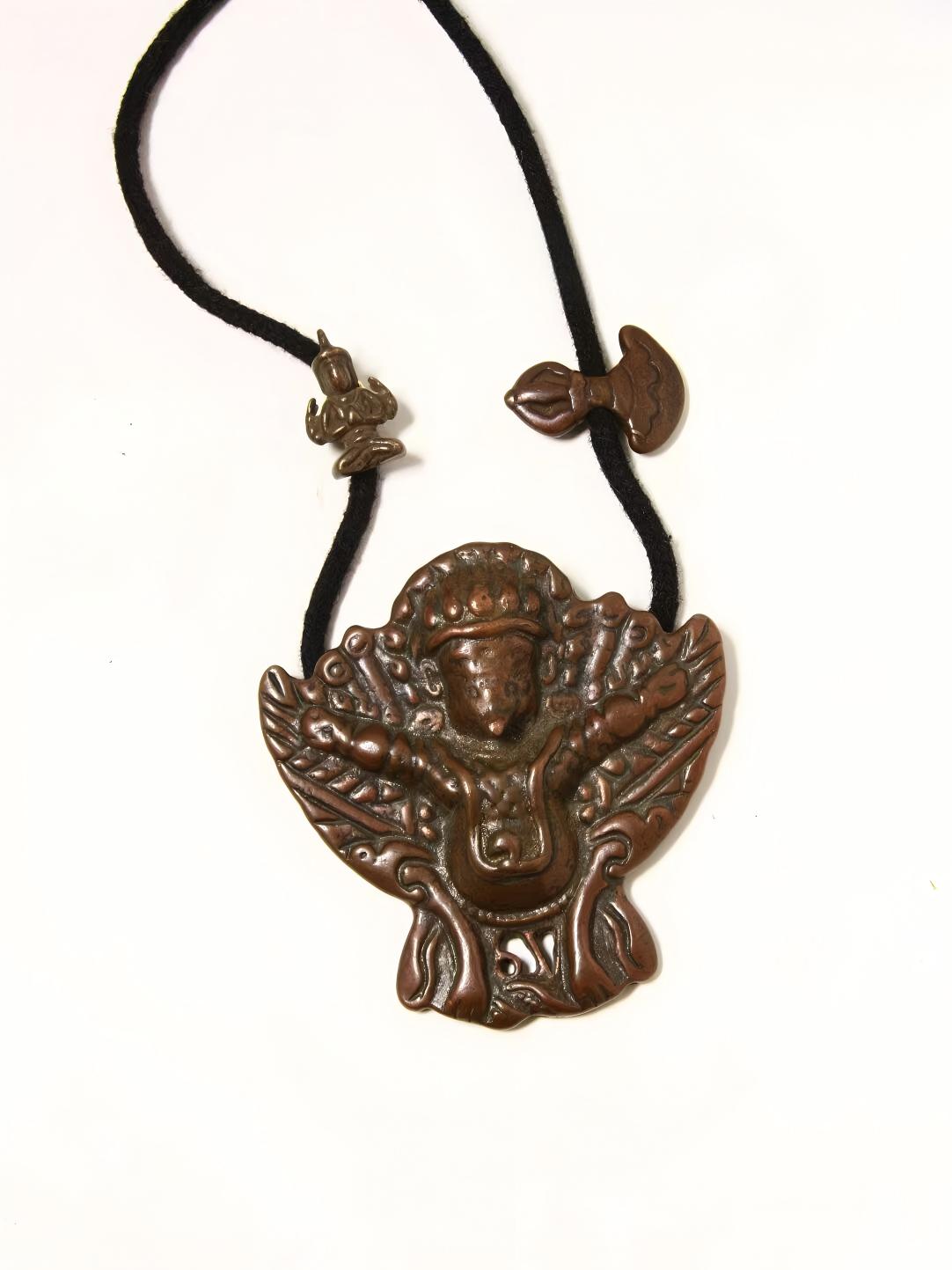 Golden Winged Bird Phoenix figure crafted from Lima copper, part of Tibetan Buddhist Jewelry Culture, offering protection, prosperity, and spiritual transformation.