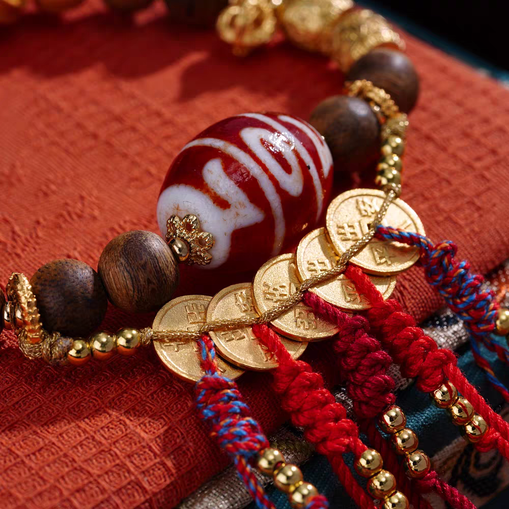 Handcrafted Tibetan Buddhist green Qinan Treasure King Three-Eye Lama tool bracelet, natural gemstone beads for luck, protection, and spiritual energy.