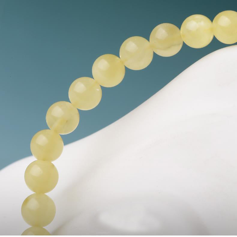 Tibetan Buddhist Jewelry Art: Amber Cinnabar Koi Gathering Bracelet, symbolizing the accumulation of luck and happiness