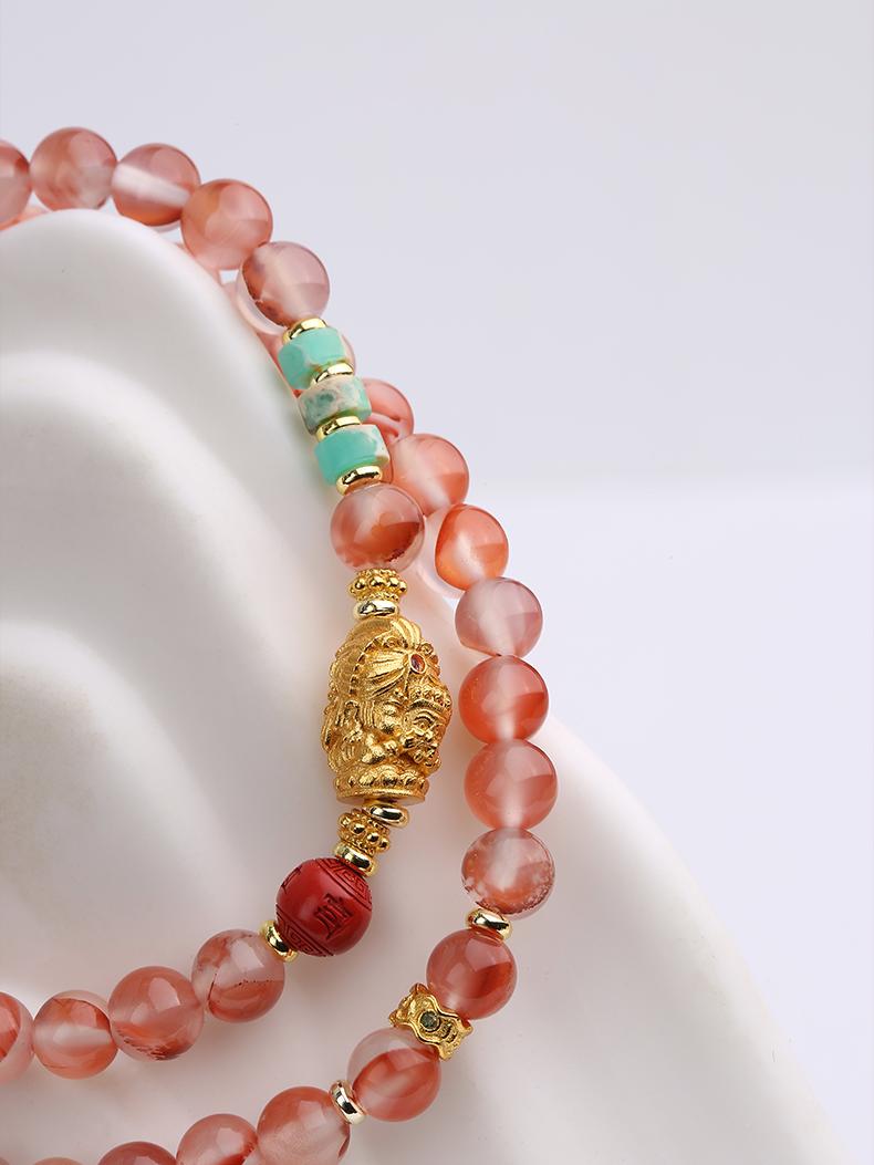 Tibetan Buddhist Jewelry Art: Red Cinnabar Glass Beads Protection Bracelet featuring traditional Tibetan Buddhist sacred patterns