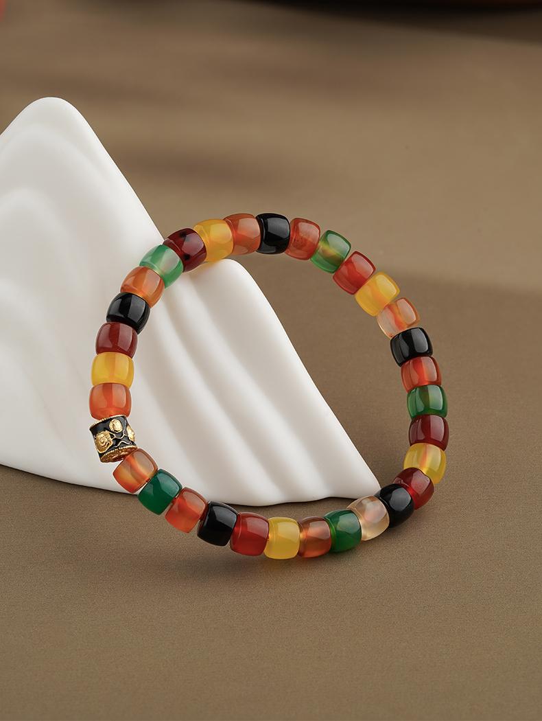 Tibetan Buddhist Jewelry Art: Hand-Painted Dark Agate Wealth Deity (Jambhala) Bracelet for prosperity and abundance in spiritual practice.