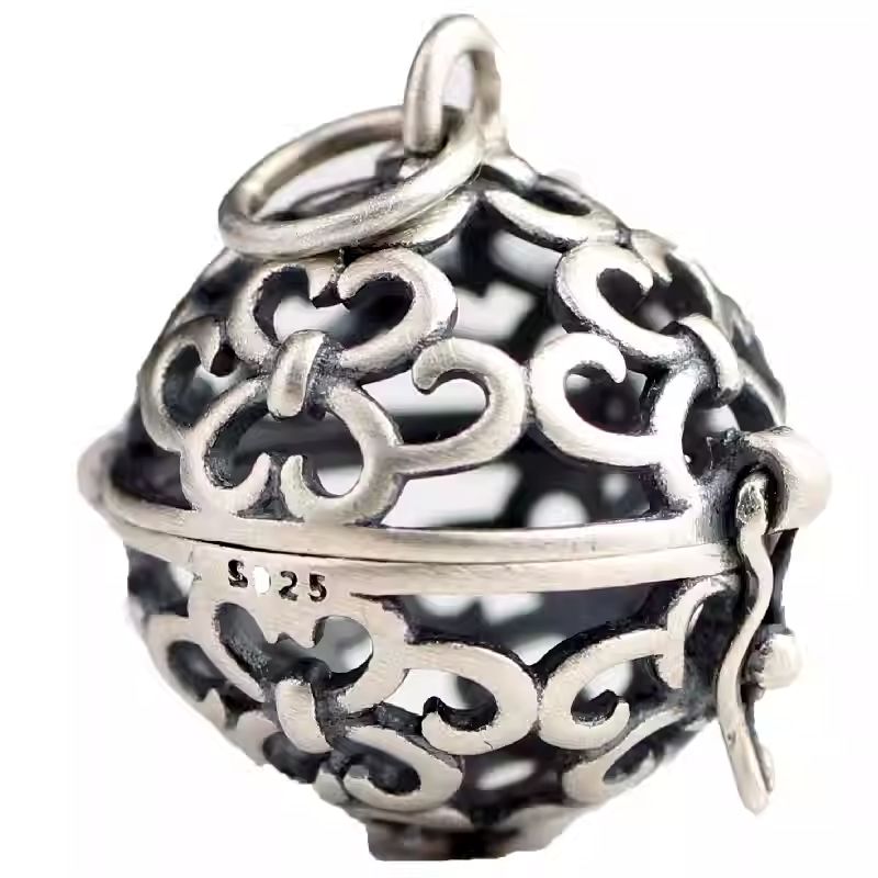 Hand-painted silver fragrance ball pendant, a spiritual Jewelry art piece rooted in Tibetan Buddhist Jewelry Culture.
