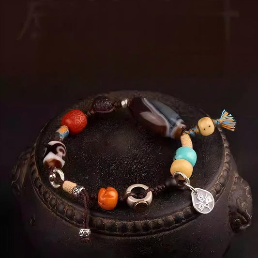 Handmade Tibetan multi-gem bracelet featuring Black Jambhala beads, unique design for spiritual energy, luck, and stylish vintage look.